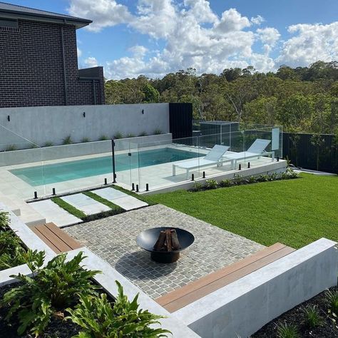 Outdoor Designer Store on Instagram: "Weekend Reset ✨...​​​​​​​​ ​​​​​​​​ Lazing by the pool in this backyard retreat is set to balance and nourish your mind, body & soul.​​​​​​​​ ​​​​​​​​ Designated fire pit area is fantastic feature in creating a focal point and a place for people to gather around and connect. ​​​​​​​​ .​​​​​​​​ Landscaping by @fcglandscaping" Backyard Pool Fire Pit, Plunge Pool And Fire Pit, Fire Pit Pool Area, Fire Pit Near Pool Area, Backyard Pool And Fire Pit Ideas, Small Pool Landscaping Ideas, Backyard With Pool And Fire Pit, Pool Outdoor Area, Pool And Fire Pit Ideas Backyards