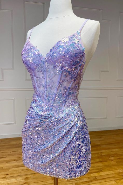 Othello, a dazzling sheath-style homecoming dress in sequin fabric. Available in Purple, Lilac, Green, and Lavender, adorned with shimmering appliques and sequins with a flattering V-neckline and sleeveless design. Complete with a zipper back, Othello is perfect for making a statement with its shimmering elegance and vibrant hues.   Details:     Silhouette: Sheath Style    Fabric: Sequin Fabric    Color: Purple, Lilac, Green, Lavender Color    Length: Short-Mini Length    Neckline: V-Neck    Sle