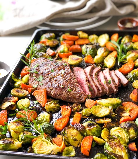 Marinated flank steak is roasted on a sheet pan along with brussels sprouts and sweet potatoes for a quick, delicious dinner meal that comes together in 35 minutes! Sheet Pan Steak And Sweet Potatoes, Flank Steak Sides, Steak And Brussel Sprouts, Sheet Pan Flank Steak, Brussels Sprouts And Sweet Potatoes, Steak Dinner Sides, Sprouting Sweet Potatoes, Sheet Pan Meals, Quick Delicious Dinner