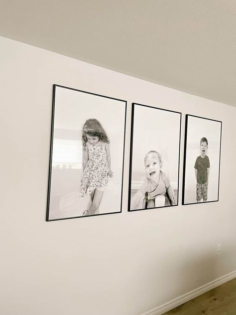 Looking for a simple way to make a big statement with portraits in your home? Read this post all about oversized wall portraits! Big Photos On Wall Living Room, Black And White Portrait Gallery Wall, Oversized Black And White Photography, Oversized Gallery Wall, Black And White Big Photo Frame Wall, Family Portrait Black And White, Large Photos On Wall Living Rooms, Canvas Photo Wall Ideas Hallway, Hallway Portraits