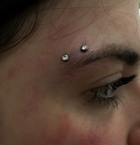 YOU MIGHT NEED THIS SURFACE PIERCING IN YOUR LIFE ‼️  HORIZONTAL EYEBROW PIERCING BY @piercernomercy_  Soho, Union Square, and Williamsburg  11AM-9PM 7 DAYS A/W🕘 WALK-INZ OR BOOK ONLINE..📕 TATTOOS & PIERCINGS, NO ATTITUDE, NO MISERABLE HOOPS TO JUMP THROUGH....🚫  WALK-INZ WELCOME OR BOOK ONLINE AT  ⚔️livebytheswordtattoo.com��⚔️ . . . . #surfacepiercing #horizontaleyebrowpiercing #eyebrowpiercing #bodypiercing #soho #manhattan Sideways Eyebrow Piercing, Tiny Eyebrow Piercing, Eyebrow Piercing Double, Horizontal Brow Piercing, Types Of Eyebrow Piercings, Septum And Eyebrow Piercing, Eyebrow Piercing Thick Eyebrows, Vertical Eyebrow Piercing, Eyebrow Piercing Pointy