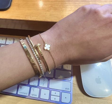 Cartier Love Bracelet Stack Apple Watch, Cartier Ring Stacking, Sweet Alhambra Bracelet Stack, Stacked Cartier Love Rings, Luxury Designer Bracelet Stack, Gold Bangles Stacked, Cartier Love Bracelet Stack Ideas, Cartier Wrist Stack, Stacking Cartier Bracelets