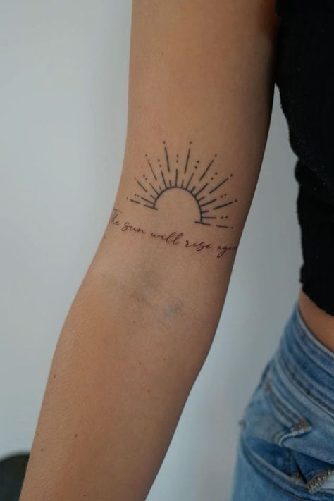 Discover 30 aesthetic tattoo ideas for women featuring delicate and minimalist designs. ✨🌸 #AestheticTattoos #MinimalistTattoos #DelicateInk #TattooIdeasForWomen #SimpleTattoos #TattooInspo #TinyTattoos #ElegantDesigns #ChicInk #TattooTrends2024 The Sun Will Still Rise Tattoo, Still I Rise With Sun Tattoo, Sunrise Tattoo With Words, Sunshine Name Tattoo, Sunshine Rainbow Tattoo, The Sun Will Shine Again Tattoo, The Sun Also Rises Tattoo, Suns Gonna Rise Tomorrow Tattoo, Sun Name Tattoo