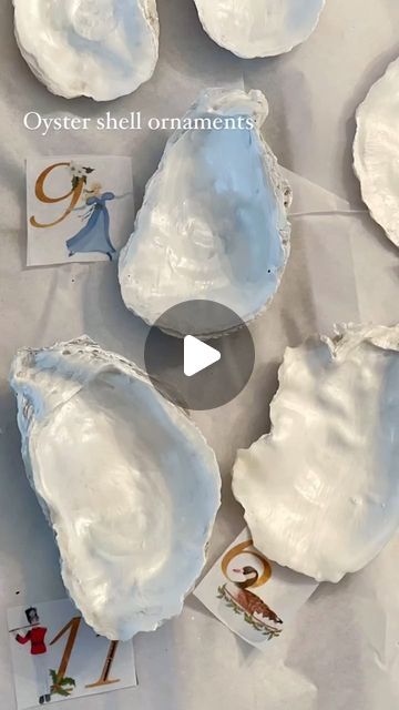 Ellen on Instagram: "I love the organic shapes of Oyster shells and these ornaments are so easy to make even last minute as place cards for the table setting. Any printed tissue paper will work or print your own as I did with the 12 days of Christmas. I’ll share the link to that clip art in stories. 
🌲 
Instructions: 
1. Wash shells
2. Paint inside with pearlized craft paint, let dry
3. Apply modge podge, I used satin
4. Apply tissue design (if covering entire shell you’ll need to trim) 
5. Cover entire inside of shell over tissue with modge podge let dry
6. I like to use gold guilding paint to edge the shell and go over any details like the numbers on the 12 days of Christmas 
Lastly I hit glued ribbon on the blue ones and on the 12 days of Christmas I glued a jewelry finding and strung Oyster Shell Christmas Ornaments Diy, Oyster Shell Wind Chimes Diy, How To Make Oyster Shell Ornaments, Modge Podge Shells, Oyster Ornaments Diy, How To Decoupage Oyster Shells, Painted Sand Dollars Ideas, Diy Oyster Shell Ornaments, Decoupage Oyster Shells Diy