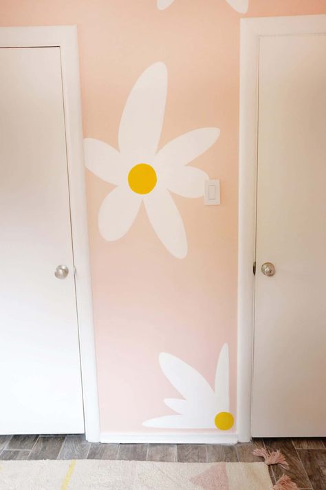 Lola's Painted Daisy Wallpaper - A Beautiful Mess Flowers Painted On Wall Nursery, Diy Daisy Wall Paint, Daisy Wall Paint, Daisy Wall Mural Diy, Hand Painted Daisy Wall, Diy Painted Flowers On Wall, Diy Painted Flower Wall, Flowers Painted On Wall, Flower Painted Wall