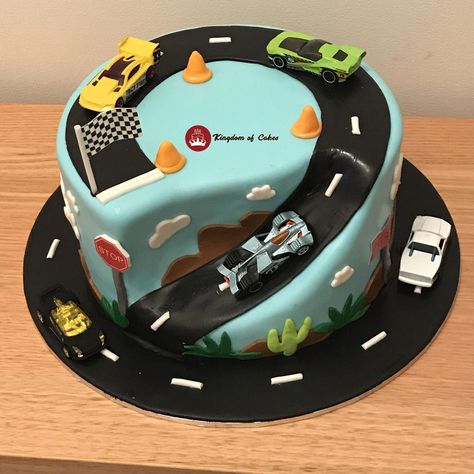 🚗🎂 Rev up your engines for this stunning car-themed road cake! With its realistic road details and adorable car toppers, it's the perfect centerpiece for any car enthusiast's celebration. 🌟🚙 Designed to delight both kids and adults, this cake is not just a treat for the taste buds but a visual feast too. 🍰🏁 Buckle up and join us for a slice of fun on this delicious journey. 🚧🎉  Delivery across Delhi NCR Visit website www.kingdomofcakes.in for more unique designs or call 9999812200 Car Truck Cake, Vehicle Cakes For Boys, Car Cake Designs For Kids, Car Cakes For Boys, Cars Cake Design, Cars Theme Cake, Car Cakes, Cake Designs For Boy, Cake Recipes For Kids