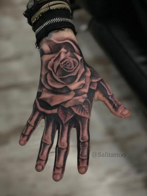 Rose hand tattoo with skeleton fingers Mens Face Tattoos, Girly Hand Tattoos, Tattoo Main, Herren Hand Tattoos, Full Hand Tattoo, Skull Hand Tattoo, Rose Hand Tattoo, Rose Tattoos For Men, Hand And Finger Tattoos