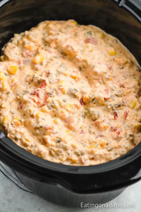 Crock Pot Cowboy Crack Dip is the perfect dip to serve for any occasion. You only need a few ingredients to make this flavorful dip. This spicy and creamy dip is a crowd favorite. It is perfect for large crowds and perfect for dipping your favorite tortilla chips in. #eatingonadime #crockpotcowboycrackdip #cowboycrackdip Ranchero Party, Queso Dip Crockpot, Spicy Sausage Dip, Slow Cooker Dip Recipes, Dip Recipes Crockpot, Slow Cooker Dips, Chip Dip Recipes, Sausage Dip, Crock Pot Dips