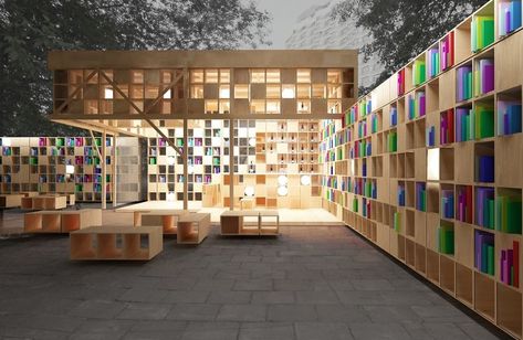 Constructed in Moscow’s Park Muzeon for Archiwood and Office 17, the book pavilion accommodates those with larger libraries, offering walls of shelf space. Extending from the covered space of the pavilion, walls of shelving provide readers with privacy both in and out of doors. Photo courtesy of Ruetemple Architectural Studio. Book Pavilion, Outdoor Library, Public Library Design, Tiny Library, Pavilion Architecture, Architectural Studio, Public Space Design, Library Architecture, Urban Furniture