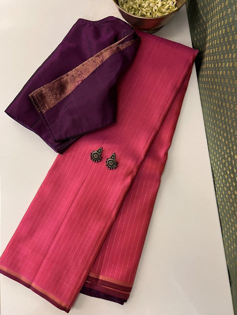 A striking colour palette brings to life this demure yet unique craftsmanship to elevated heights. A bright fuschia pure handwoven silk saree with subtle pure zari lines woven through the body, stands in vivid contrast to a violet pallu with a unique pairing of buttas and stripes. Paired with a contrast blouse piece, pieces like this are hard to come by. Blouses Designs, Indian Saree Blouse, Indian Saree Blouses Designs, Saree Blouses, Contrast Blouse, Kanchipuram Silk Saree, Indian Saree, Designer Sarees, Unique Designers