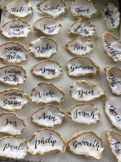 Shell Party Decorations, Oyster Place Setting, Beach Dinner Party Table, Oysters At Wedding, Beach Rehearsal Dinner Decorations, Wedding Shell Decor, Oyster Party Decorations, Elegant Beach Bridal Shower Ideas, Oyster Shell Place Setting