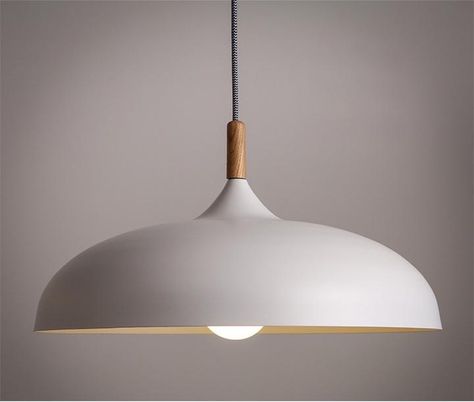 an look and organic form of this beautiful ceiling light. The combination of white or black with a wooden crown gives it a distinctly scandinavian feel that is so popular for its combination of simplicity and warmth. A black and white textile hanging cord adds further detail and interest. Great for bring Scandinavian Light Fixtures, Lighting Scandinavian, Kitchen Pendant Lights, Kitchen Nordic, Scandinavian Light, Nordic Vintage, Lampe Art Deco, Scandinavian Lighting, Nordic Pendant Light