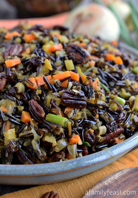 The best Wild Rice recipe! Tender wild rice tossed with vegetables, currants and pecans and cooked in an orange-vermouth broth. Very delicious! Wild Rice Recipes Side Dishes, Wild Rice Recipe, Rice Recipes Side, Wild Rice Recipes, Rice Side Dish Recipes, Wild Rice Casserole, Cooking Wild Rice, Wild Rice Salad, Rice Side Dishes