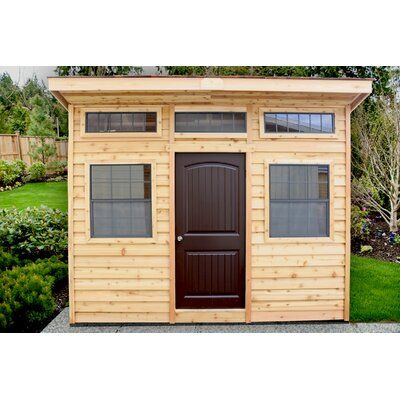 The shed features a fresh new modern design for the urban multipurpose garden building. It's functional as a garden shed, creative studio, storage space, or guest room. Use it to maximize your space to be functional and comfortable! | Outdoor Living Today 12 ft. W x 8 ft. D Cedar Wood Studio Garden Shed in Brown, Size 117.0 H x 144.0 W x 96.0 D in | Wayfair Cedar Shingle Roof, Cedar Roof, Lean To, Simple Shed, Fire Pit Area, Backyard Sheds, Backyard Shed, Shed Design, Garden Buildings