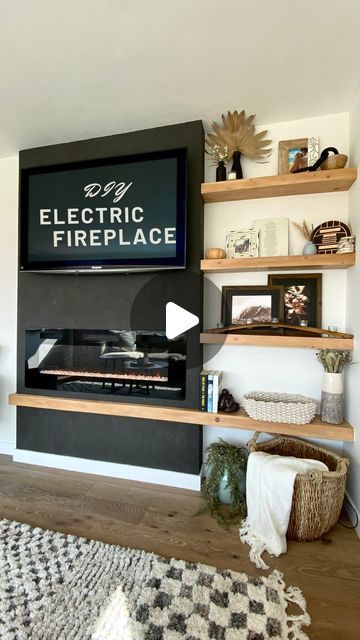 Gabrielle Bourne | Actress & Builder on Instagram: "Part 1 of my DIY electric fireplace + floating shelves build 😍. When your living room is small so you can’t afford to lose any space with a built in, these floating shelves are a great option to create interest!! Follow so you don’t miss part 2 where I show you how I built these floating shelves. 
  ⠀⠀⠀⠀⠀⠀⠀⠀⠀⠀⠀⠀
#girlswhobuild #floatingshelves #portola #romanclay #blackeverything #diy #diyfireplace #doityourself" Floating Fireplace Ideas, Built In Shelves Living Room Fireplace, Fireplace Floating Shelves, Diy Electric Fireplace, Floating Fireplace, Living Room Built Ins, Diy Fireplace, Wall Mounted Tv, Mounted Tv