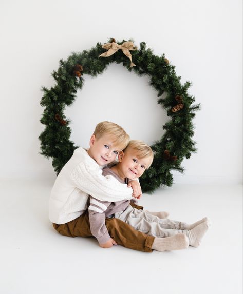 Brothers sitting together on Christmas shoot Simple Family Christmas Pictures At Home, Minimal Christmas Photography, Minimalist Christmas Family Photoshoot, Christmas Photoshoot Home Ideas, Christmas Siblings Photoshoot, Christmas Brothers Photoshoot, Christmas Photo Session Studio, Christmas Mini Shoot Indoor, Christmas Photoshoot In Studio