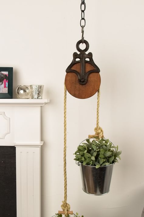 Get Familiar with Farmhouse - American Lifestyle Magazine Old Pully Ideas, Pulley Plant Hangers, Antique Pulley Plant Hanger, Pulley Decor Ideas, Pulley System For Hanging Plants, Hanging Plant Pulley System, Wooden Pulley Ideas, Plant Pulley System, Old Tools Decor Ideas