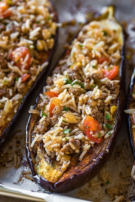 This savory stuffed eggplant with middle eastern spices and a garlic tahini sauce Different Meat Recipes, Mediterranean Stuffed Eggplant, Eggplant With Rice, Eggplant Minced Meat Recipes, Turkish Healthy Recipes, Healthy Meal Prep No Meat, Stuffed Egg Plant Recipes, Eggplant Recipes With Meat, Turkish Stuffed Eggplant