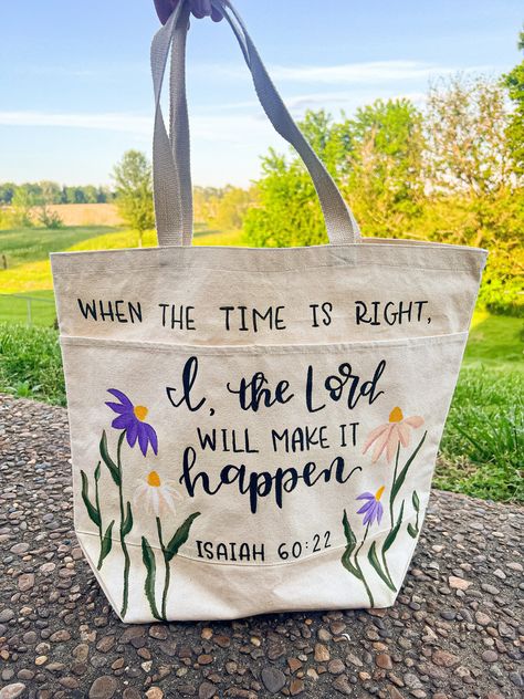 Handpainted and handlettered tote bag. Perfect for a Bible bag, book bag, or for carrying essentials! It has a rectangular shape with a large main pocket and two braided handles on top. Two more pockets are sewn onto the front of the bag, allowing for even more storage and organization. Dimensions: 16" x 18" x 6"  Handle Drop Length: 8" Content: 100% Cotton Color: Natural Painted Bags Canvas, Brown Bag Decorating Ideas, Christian Craft Ideas For Women, Bible Bag Ideas, Paint Canvas Bag, Bible Bag Painting, Diy Bible Bag, Painting Christian Ideas, Cute Tote Bag Ideas