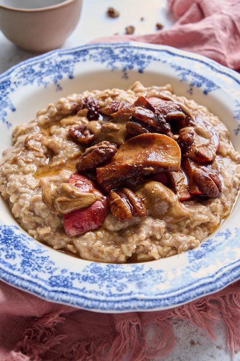 Are you tired of the same old boring breakfast routine? Do you want to switch things up and try something new and exciting? Look no further than this delicious, healthy breakfast recipe for cinnamon apple and pecan porridge. Packed with essential nutrients: this breakfast option will become a staple in your morning routine. This vegan porridge recipe is a delicious combination of warm, comforting flavours and creamy textures. For more, follow #HINTSDEDIEM Barley Porridge Breakfast, Pumpkin Porridge Recipe, Apple And Cinnamon Porridge, Apple Porridge, Porridge Healthy, Vegan Porridge, Millet Pumpkin Porridge, Spiced Apple Pie, Oat Porridge