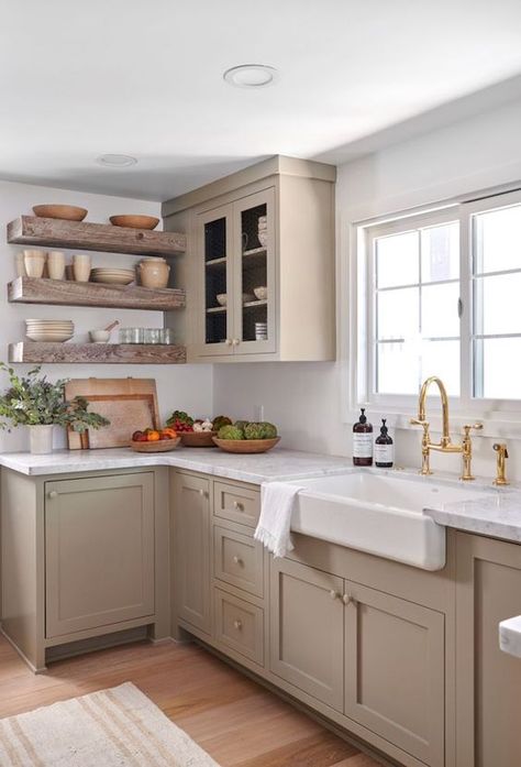 a taupe farmhouse kitchen design against white walls Beige Country Kitchen, Small Beige Kitchen Ideas, Beige Shaker Kitchen, Neutral Painted Kitchen Cabinets, Light Taupe Kitchen Cabinets, Kitchen With Cream Cabinets, Kitchen With White Countertops, Light Grey Countertops, 70s Kitchen Remodel