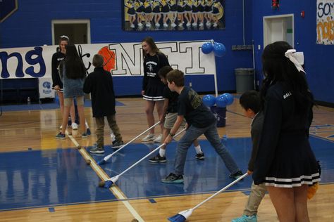 "Sweep" the potato to the other end. Fun game for pep rallies. Non Athletic Games, High School Pep Rally Games, Hoco Pep Rally Games, Pep Rally Game Ideas High Schools, Basketball Pep Rally Games, Rally Games High School, Pep Rally Games High School Ideas, Pep Rally Ideas Games, Assembly Games Highschool