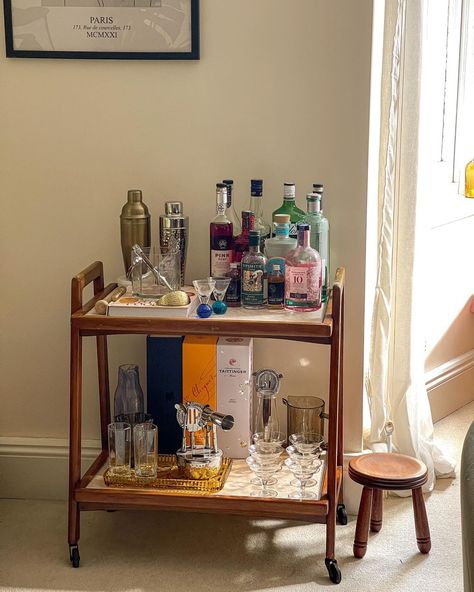 Cait 〰️ interiors + lifestyle | New (old) bar cart alert 🍸 picked this beauty up for the grand sum of five English pounds at a car boot sale at the weekend, and couldn’t… | Instagram Mini Bar Station, Bar Cart Mid Century, Wooden Bar Cart Styling, Bar Cart Home Decor, Alcohol Tray Bar Carts, Antique Bar Cart Styling, Bar Cart Items, Home Cocktail Station, Small Space Bar Cart