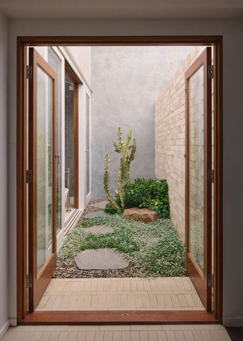 From inside to outside, and internally through a series of private courtyards, there is always an opportunity to engage with the natural environment. Roof plantings are also designed to sprawl and grow over the structure. “The intention eventually is for the building to be dominated and returned to the landscape over time,” he says. #privategarden #courtyard #gardendesign #landscaping #familyhome #homedesign #homedesignideas #architecture #houseplants Small Courtyard, Louvered Shutters, Clad Home, Courtyard Design, Internal Courtyard, Masonry Wall, Australian Architecture, Storey Homes, Patio Interior