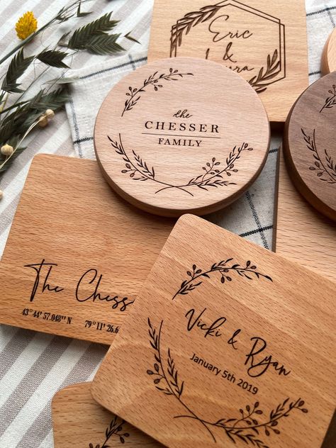 A set of premium quality wood coasters, engraved to keep special memories always within reach.  Protect surfaces and make any drink meaningful with our personalized coasters. Made from natural wood, and engraved by us with a custom design created to your liking. They make the perfect gift for any occasion--commemorating a wedding, an anniversary, or a new home-- that your loved ones can enjoy every day.  Each piece is crafted with the utmost care: engraved by a precise CO2 laser machine, and pol Pyrography Wedding Gift, Wedding Gift Coasters, Wood Burned Wedding Gift, Engraved Wood Ideas, Small Laser Engraving Ideas, Laser Machine Ideas, Wood Etching Ideas, Laser Engraved Wedding Gifts, Glowforge Projects Ideas To Sell