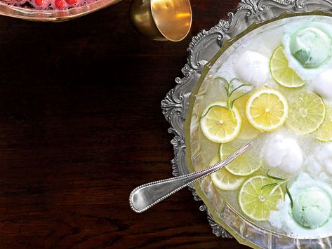 Lemon-Lime-Rosemary Punch | Every baby shower and holiday party in the South will welcome a festive punch bowl with mounds of sherbet floating on top. Put a fragrant spin on this classic citrus punch for a refreshing, tart, herb-infused beverage. Easter Punch Recipes, Easter Punch, Best Christmas Punch Recipe, Party Punch Alcohol, Christmas Mocktail, Spring Feast, Shower Punch, Party Beverages, Shower Checklist