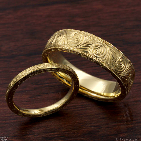 A vintage-inspired wedding band featuring ornate and delicate hand-carved swirls. Perfected by our master jewelers, filagree accents circle the band. A ring fit for royalty!

Shown in 14k yellow gold. Carved Gold Ring, Embossed Engagement Ring, Gold Engraved Ring, Matching Engraved Wedding Bands, Engraved Gold Wedding Band, Ornate Gold Engraved Ring With Intricate Design, Traditional Carved Engraved Wedding Ring, Ornate Gold Engraved Filigree Ring, Ornate Yellow Gold Engraved Wedding Ring