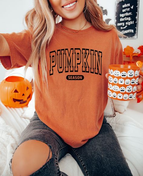 This cozy Comfort Colors tee is the perfect gift for a lady ( or for yourself of course)!  Featuring the saying "Pumpkin season" in bold letters on the front, this shirt is stylish and cute fall wear. For the kids shirt: https://www.etsy.com/listing/1559993991/pumpkin-season-shirt-for-girls-kids?click_key=d07477a03db3f0f288d7bcc666fc59e468e34351%3A1559993991&click_sum=d952a7f8&ref=shop_home_active_19&pro=1&sts=1 𝐇𝐎𝐖 𝐓𝐎 𝐎𝐑𝐃𝐄𝐑 1. Select the size & color when applicable 2. Add the persona Fall Graphic Tees Trendy, Fall Svgs For Shirts, Simple Vinyl Shirts For Women, Fall Diy Shirts, Fall T-shirt, Diy Fall Shirts Vinyl, Fall Shirt Ideas Vinyl, Fall Cricut Shirts, Fall T Shirt Design Ideas