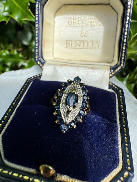 Vintage 9ct yellow gold diamond accented sapphire ring, marquise shape, UK size L, US size 5.75. Weight 3.8g. The band is minimally misshapen, otherwise in perfect condition. Setting size 2cm x 1.4cm. An absolute stunner. Art Deco Vintage Ring, Vintage Rings Antiques, Safire Rings, Sapphire Ring Vintage, Vintage Jewelry Rings, Vintage Sapphire Ring, Vintage Diamond Ring, Saphir Ring, Gold Sapphire Ring