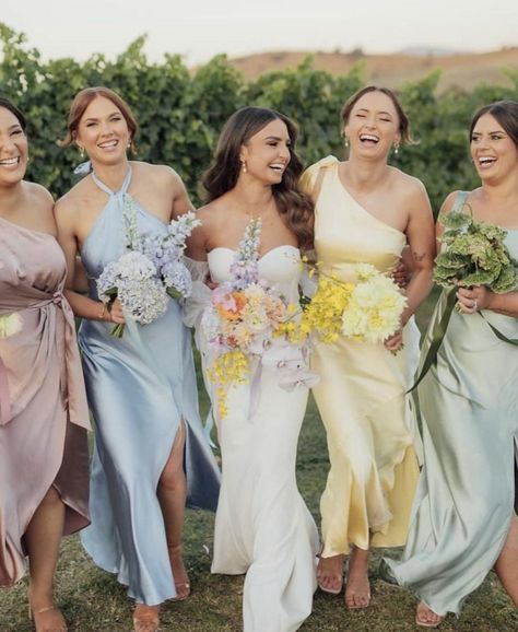 @loverly on Instagram Vogue Wedding Guest Outfit, Summer Garden Bridesmaid Dresses, Colorful Wedding Party Attire, Pastel Wedding Guest Outfit, Spring Bridesmaid Dresses Mismatched, Bridesmaid Lineup, Wildflower Bridesmaid Dresses, Wildflower Wedding Bridesmaids, Multi Colored Bridesmaid Dresses