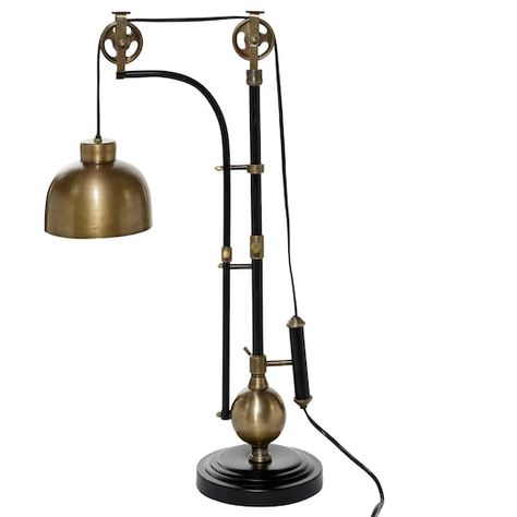 Find the 31" Black & Gold Metal Industrial Table Lamp at Michaels. com. A functional and stylish night light is what this black and gold table lamp is. A functional and stylish night light is what this black and gold table lamp is. It's constructed from a combination of metals, namely iron and aluminum. The simplicity in its finish and pulley design concept match well with industrial themed bedrooms, personal libraries, and offices. This lampshade powers via plug in electricity and does not Pulley Floor Lamp, Black And Gold Table, Black Metal Floor Lamp, Metal Room, Tall Table Lamps, Industrial Table Lamp, Luxury Lamps, Tall Lamps, Gold Table Lamp