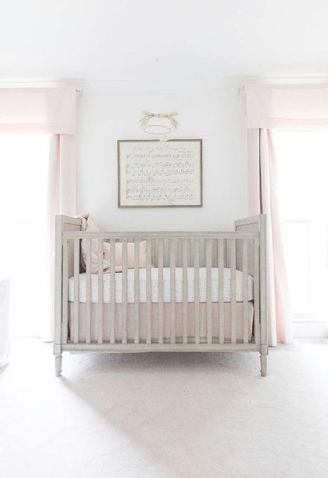 A Restoration Hardware Baby & Child Marcelle Crib is positioned on a RH Baby & Child Scallop Wool Rug beneath a framed Antique Sheet Music - Hush Little Baby mounted between windows dressed in Cotton Canvas Drapery Panels. Nursery Rustic, Lay Baby Lay, Best Baby Cribs, Neutral Crib, Restoration Hardware Baby, Baby Sheets, Rh Baby, Girl Cribs, Rustic Nursery