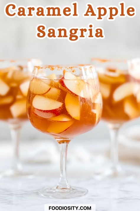 Craving a sweet, refreshing drink for fall? This Caramel Apple Sangria blends crisp apple flavors with a hint of caramel, creating the perfect autumn cocktail for any gathering. Whether you're hosting a party or just want to sip something festive, this sangria is a must-try! Click to get the easy recipe and add a sweet twist to your fall celebrations! Carmel Apple Sangria Easy, Caramel Apple Cider Sangria, Sweet Cocktails Easy, Carmel Vodka, Apple Pie Sangria, Thanksgiving Sangria, Autumn Cocktail, Fall Sangria Recipes, Caramel Apple Sangria