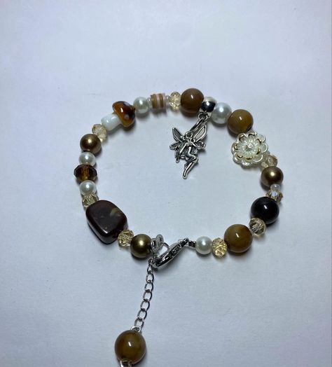 brown fairycharm Brown Jewelry Aesthetic, Brown Bracelet Ideas, Purse Dangles, Access Granted, Beaded Diy, Beaded Stuff, Bracelet Inspiration, Knots Diy, Brown Bracelet