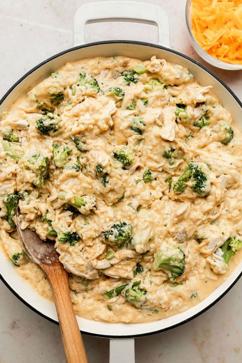 If you love our baked Chicken and Rice Casserole, then this is the easy dinner recipe for you! We've taken that classically good combination of cheese, chicken, broccoli, and rice that is so loved and turned it into a simple stovetop version made all in one skillet. Cheesy Chicken Skillet, Baked Chicken And Rice Casserole, Chicken Broccoli Rice Cheese Casserole, Cooked Rice Recipes, Baked Chicken And Rice, Cheesy Broccoli Rice, Broccoli And Rice, Chicken Broccoli Rice Casserole, Chicken And Rice Casserole