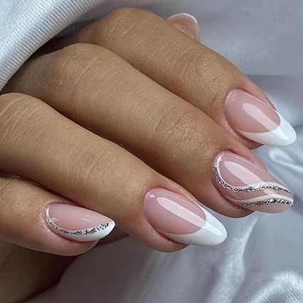 Hey there, gorgeous! 😍 Get your hands on our sassy French Tip Press On Nails. 🇫🇷💅 Rock that cute and classy look with these Almond White Fake Nails featuring Silver Curve Glue Ons. 💎 Ideal for all the lovely ladies out there, they're just perfect for any occasion - be it weddings or birthdays. 🎉 No need for acrylic gel, just stick 'em on and you're good to go! 🚀 Acrylic Nails Almond Wedding, White Grad Nails Almond, White French Tip Nails With Silver, Silver And White French Tip Nails, Beige Nails Almond, Grad Nails Almond, White And Silver French Tip Nails, Silver And White Acrylic Nails, Summer Nails Silver