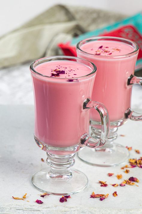 You’ll love this easy and quick-to-make rose milk! It’s made with simple 4 ingredients and gets ready in 2 minutes only. Enjoy it cold as a refreshing summer drink. Rose Milk Recipe, Rose Milk Aesthetic, Rose Drink, Indian Drinks, Rose Milk, Refreshing Summer Drinks, Clam Recipes, Sugar Cravings, Indian Sweets