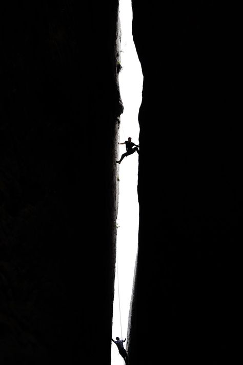 Silhouette of Men Rock Climbing in the Gap between Two Cliffs · Free Stock Photo Free Climbing Aesthetic, In Between Aesthetic, Climber Aesthetic, Gap Aesthetic, Climbing Silhouette, Rock Climbing Aesthetic, Climbing Aesthetic, Rock Climbing Photography, Women Climbing