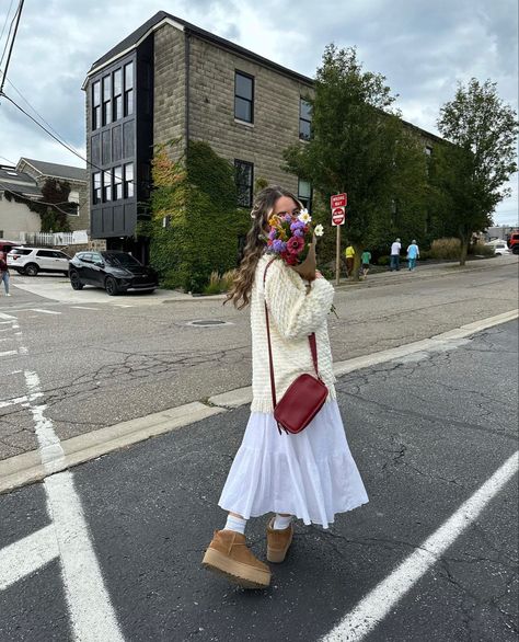 fall maxi skirt outfit rory gilmore sweater platform mini uggs inspo flower boquet brown paper inspo autumn vibes Skirts And Uggs Outfits, Ugg Boot Skirt Outfit, Long Dress And Uggs Outfit, Ugg Spring Outfit, Lace Uggs Outfit, Uggs With Skirt Fit, Maxi Skirt And Sweater Outfit Fall, Ugg Tasman Skirt Outfit, Ugg And Skirt Outfit