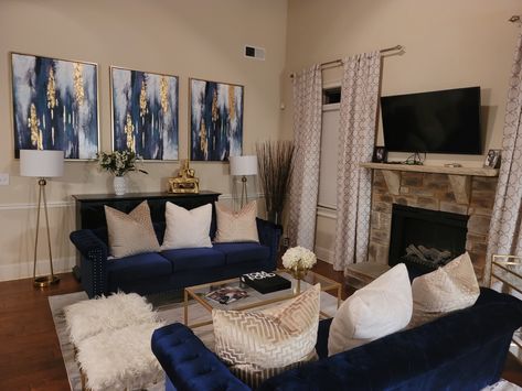 Grey And Blue Decorating Ideas, Navy Gold Living Room Decor, Brown And Blue Apartment Living Room, Blue Grey Black Gold Living Room, Blue White Gold Living Room Decor, Navy Blue Couch Living Room Gold Accents, Navy Blue And Grey Apartment Decor, Navy Blue Gray And Gold Living Room, Tan Navy Blue And Gold Living Room