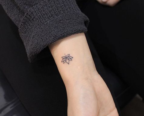 30 Lotus Tattoo Ideas That Symbolize Purity & Enlightenment | 30 Lotus Tattoo Ideas These lotus tattoos symbolize personal growth and enlightenment! Lifestyle Lotus Men Tattoo, Purity Tattoo Symbols, Men Lotus Tattoo, Self Growth Tattoo Ideas For Women, Flower Bud Tattoo, Tattoos Symbolizing Growth, Lotus Flower Wrist Tattoo, Lotus Tattoos For Women, Lotus Flower Tattoo Men