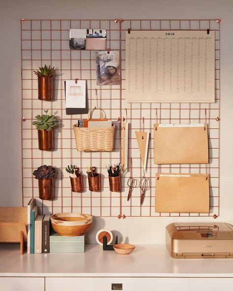 To keep your desktop uncluttered, hang supplies and folders from hooks and clips on an easy access grid. Urban Outfitters wire wall grids, in Copper (4 shown), $59 each, urbanoutfitters.com. Lostine copper cups, $30 for small and $45 for large, lostine.com. Basketville Upscale Mail basket, $17, basketville.com. hang copper containers on kitchen wall for peppers Decoration Candles, Hiasan Bilik Tidur, Smart Tiles, Wall Desk, Home Office Organization, Decor Minimalist, Cheap Diy, Home Office Design, Room Organization