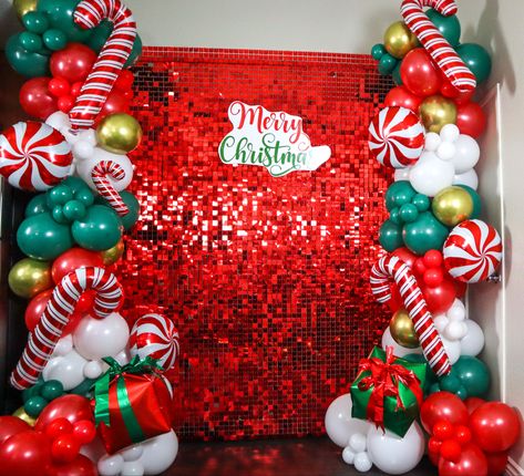 Christmas Party Background Ideas, Christmas Party Birthday Ideas, Red Shimmer Wall Backdrop, Christmas Party Decorations Balloons, Christmas Theme Birthday Decoration, Friendsmas Backdrop Ideas, Christmas Decorations Party Events, Christmas Picture Decoration Ideas, Christmas Shimmer Wall