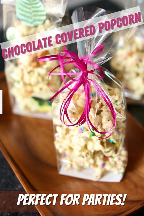 a celophane bag with chocolate covered popcorn in it. Covered Popcorn, Chocolate Cover Popcorn, Popcorn Packaging Ideas, Chocolate Covered Popcorn Recipe, Candy Popcorn Recipe, Chocolate Drizzled Popcorn, Birthday Popcorn, Chocolate Covered Popcorn, Chocolate Raisins