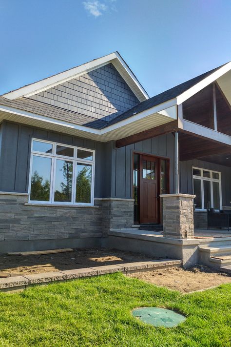 JAMES HARDIE BOARD & BATTEN & LAP SIDING - NIGHT GRAY - CARP - Traditional - Exterior - Ottawa - by Munro Contracting | Houzz House With Board And Batten Exterior, Shaker And Board And Batten Exterior, Vertical Siding On Ranch House, Hardie Board Siding Ranch House, Baton Board Exterior, Board And Batten Siding Gray, Wide Siding Exterior, James Hardie Exterior, Hardy Board Siding With Brick