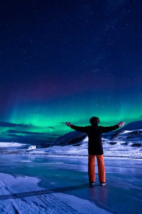 A person enjoying an aurora borealis display near Longyearbyen, Svalbard Green Taylor Swift, Longyearbyen Svalbard, Aurora Borealis Green, Winter Architecture, Norway Hotel, Sunset Winter, Longyearbyen, Northern Lights Norway, Aurora Australis